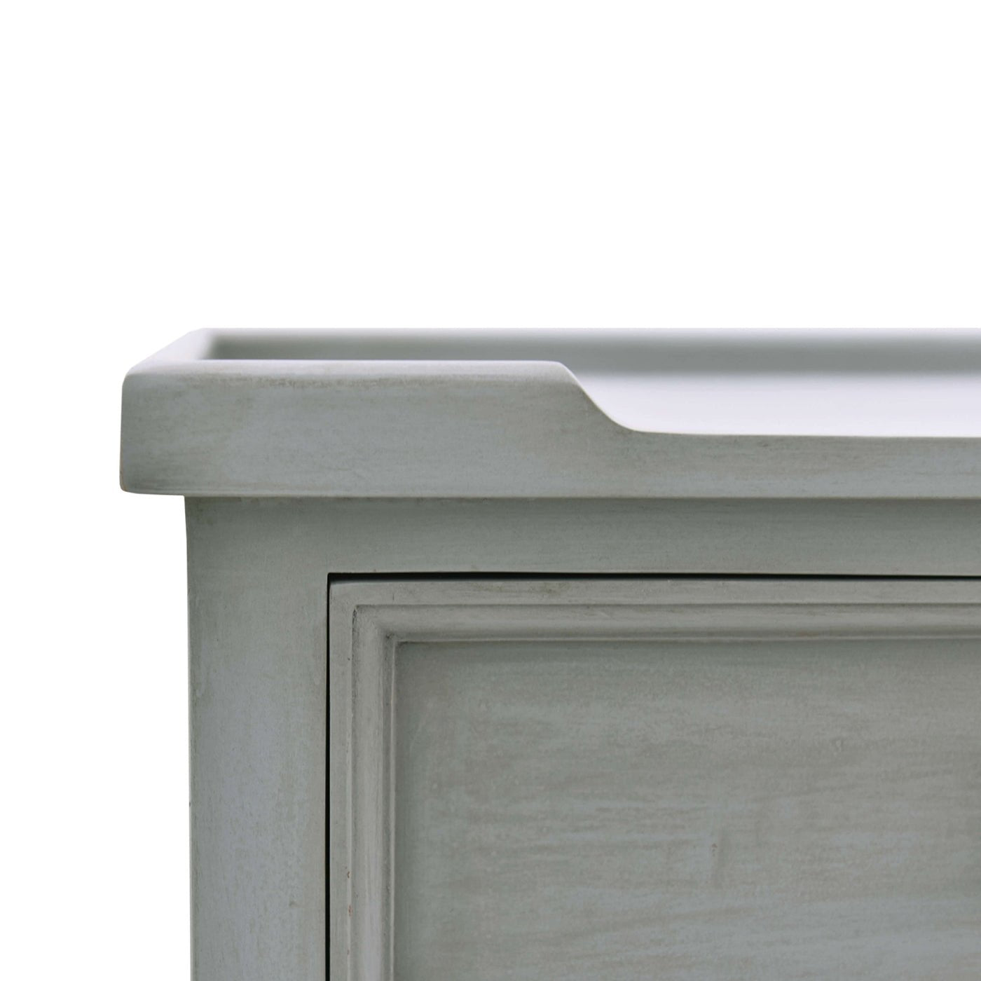 Close-up of tabletop edge, gray end table.