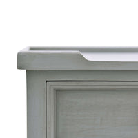 Close-up of tabletop edge, gray end table.