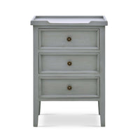 Front view of gray three-drawer end table.