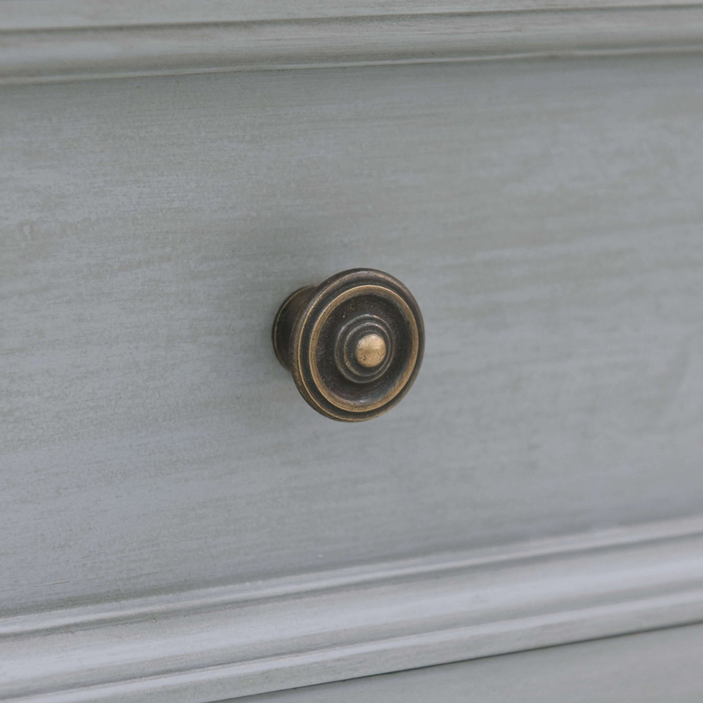 Close-up of drawer handle, traditional style.