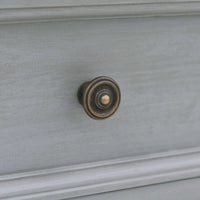 Close-up of drawer handle, traditional style.