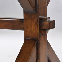 Close-up of trestle dining table joinery detail.