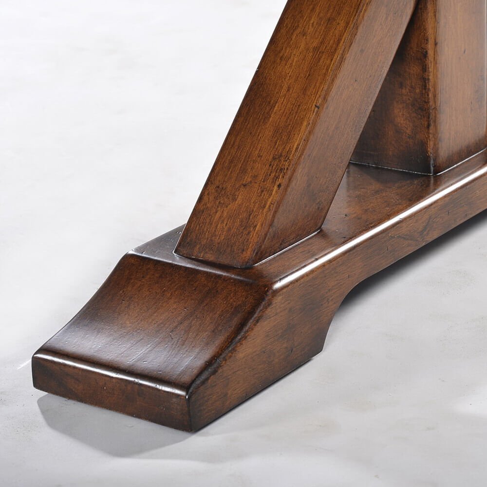 Close-up of dining table leg and base design.