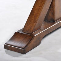 Close-up of dining table leg and base design.