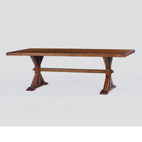 Wooden dining table, angled side view, light background.