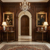 Two demilune console tables in elegant hallway setting.