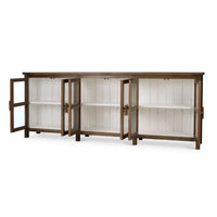 Open doors of sideboard showcasing interior shelves.