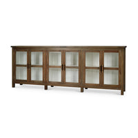 Rustic wood sideboard with glass doors, angled view.
