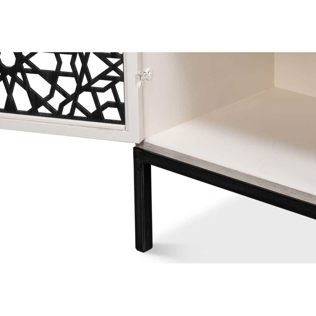 Bottom corner of open Covet Credenza, black metal leg detail.
