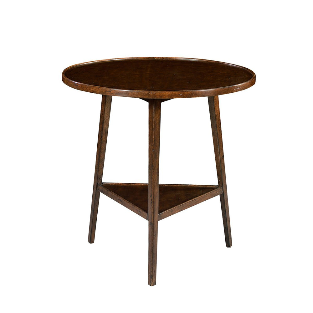 Round wooden side table on white background.