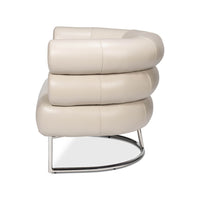 Side profile of white leather accent chair.