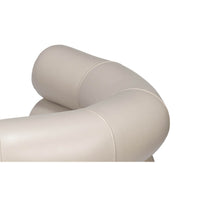 Armrest detail on white leather accent chair.