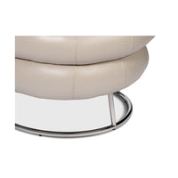 Chrome base detail of leather accent chair.