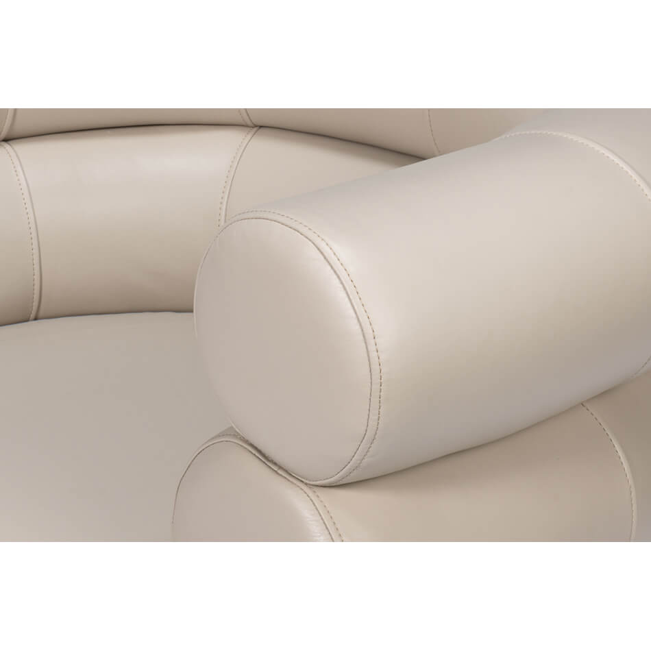 Arm and cushion details on leather accent chair.