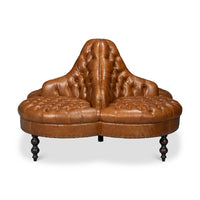 Brown sofa with tufted detail, front angle.