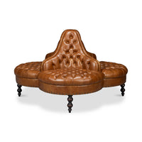 Four-sided brown lobby sofa, front view.