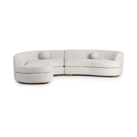 Front view of ivory bouclé sectional showing its curved seating and attached seat cushions