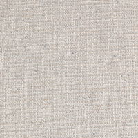 Detail of the ivory bouclé upholstery showing its woven, textured surface
