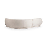 Rear view of cream sectional showing the sweeping upholstered back and center join
