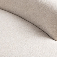 Close-up of cream sectional upholstery where the curved back meets the seat