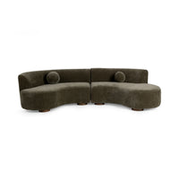 Front view of olive green two-piece curved sectional with two round accent pillows and short wood feet