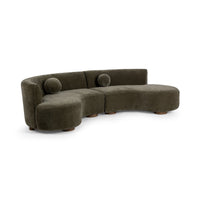 Angled view of olive green sectional showing its rounded seat end and low curved back