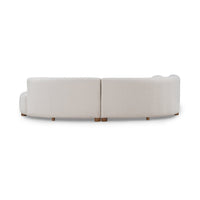 Rear view of ivory two-piece curved sectional showing its upholstered back and center join