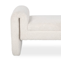 Close-up of the ivory bench showing the rounded upholstered arm, seat edge and nubby fabric texture