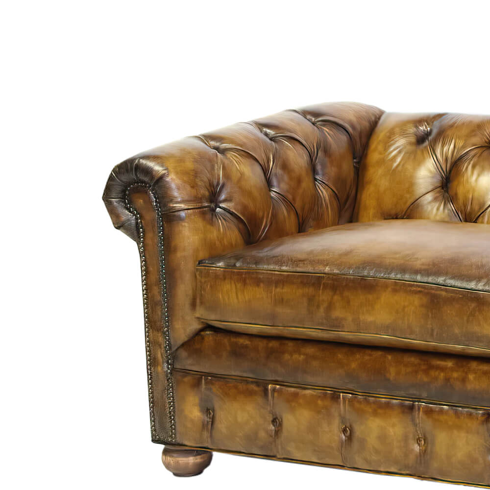 Detailed view Chesterfield sofa arm, intricate tufted craftsmanship.