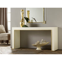 Styled white console table with decorative objects in room