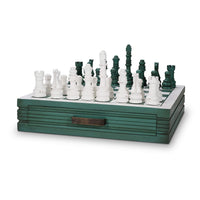 Green wooden chess board with white and green pieces.