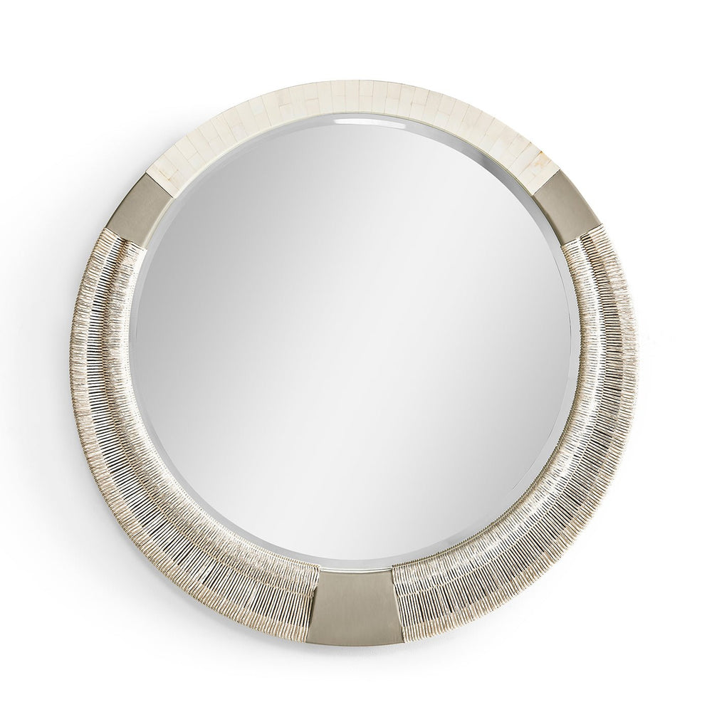 Round decorative mirror with braided frame, close-up view.