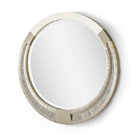 Modern round mirror with detailed edge design.