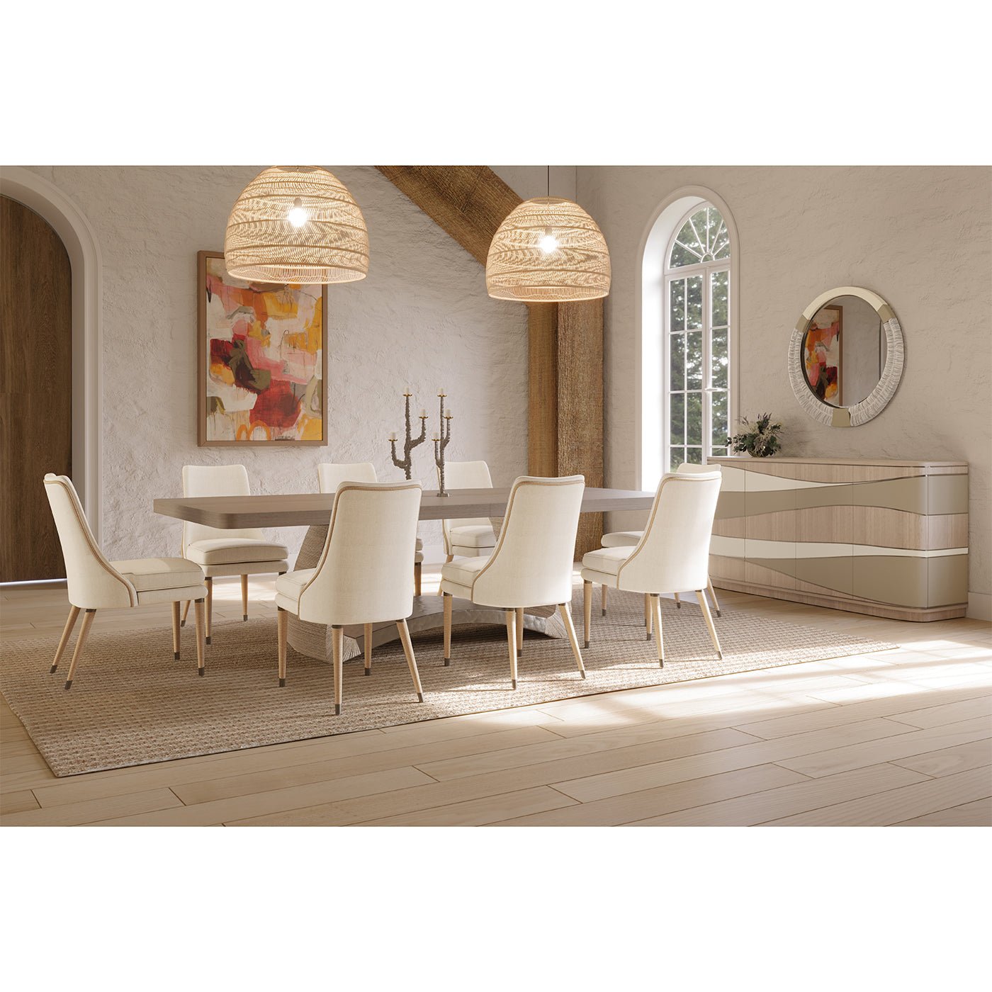 Dining room with round mirror on wall.