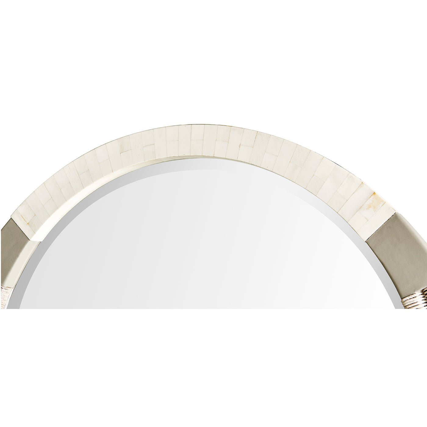 Close-up of round mirror's top braided and metal accents.