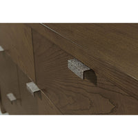 Close-up of dark ash dresser handle and wood detail.