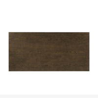 Top view of dark ash modern desk, wood grain detail.