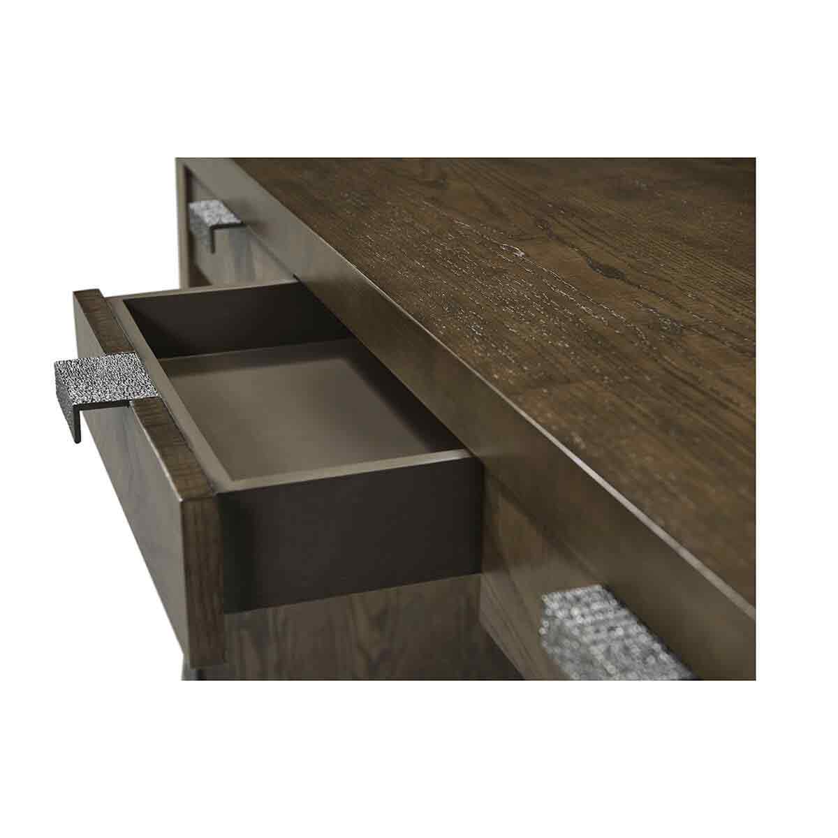 Open drawer of dark ash desk, interior view.