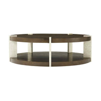 Round coffee table highlighting lower shelf, dark ash wood.