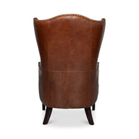 Rear view, dark brown high back leather wing chair.