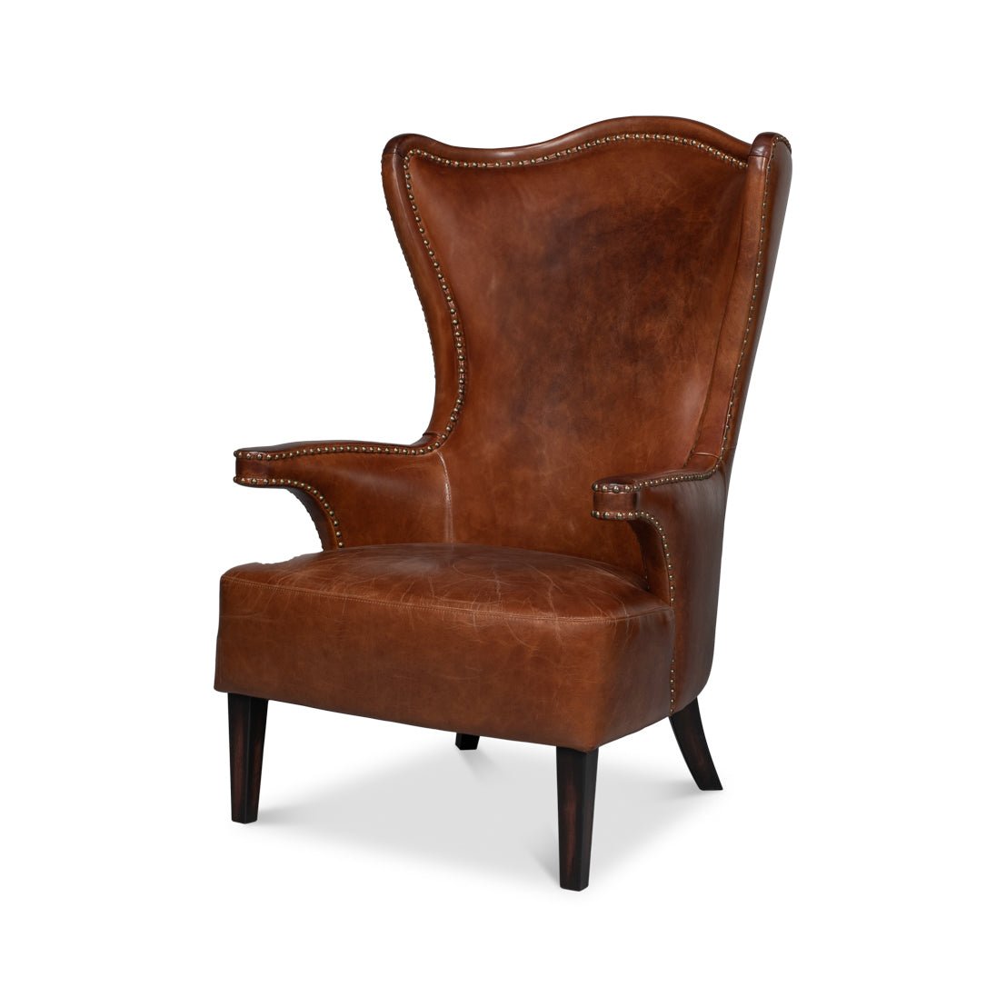 Dark brown high back leather wing chair, angled view.