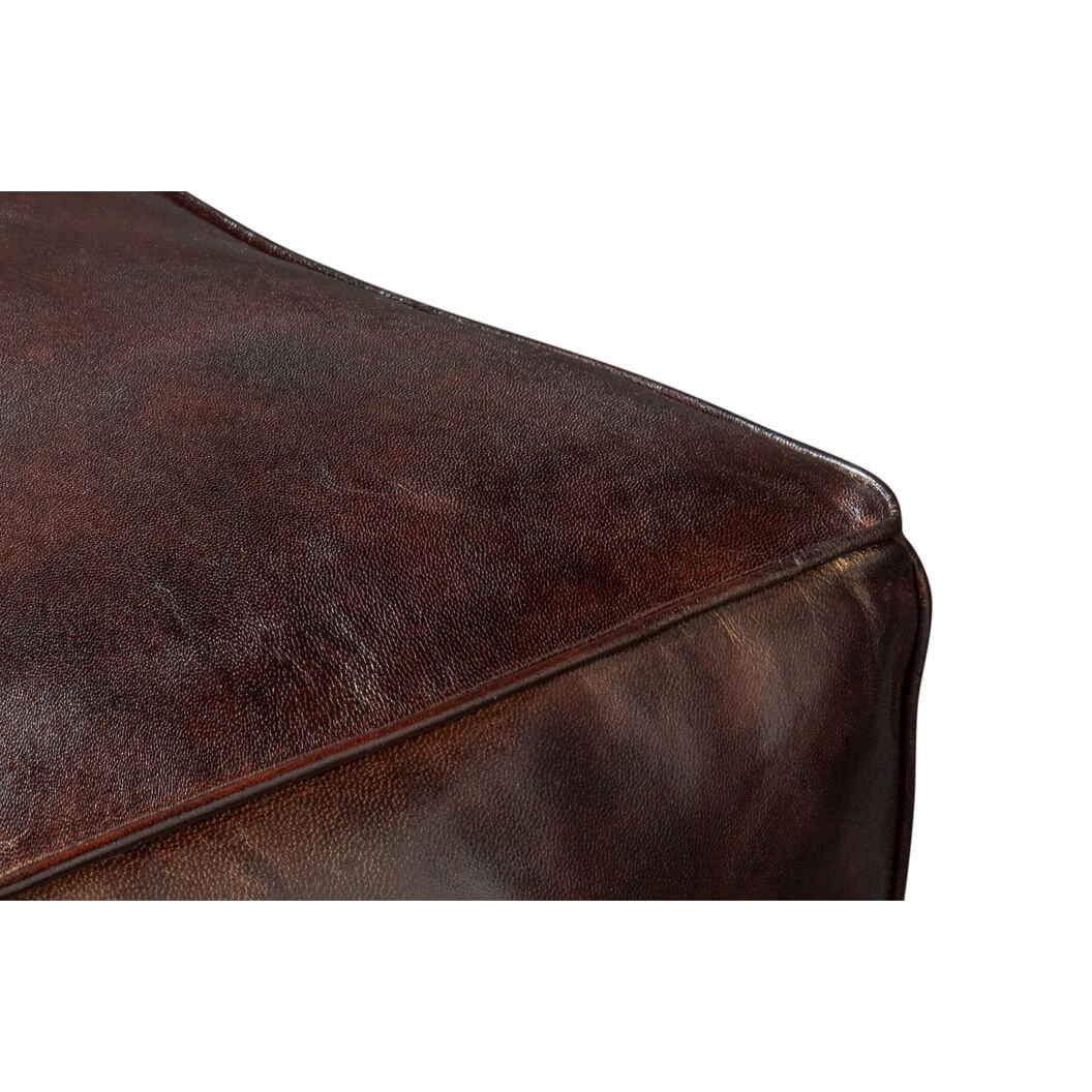 Close-up detail of corner stitching, leather cube stool.