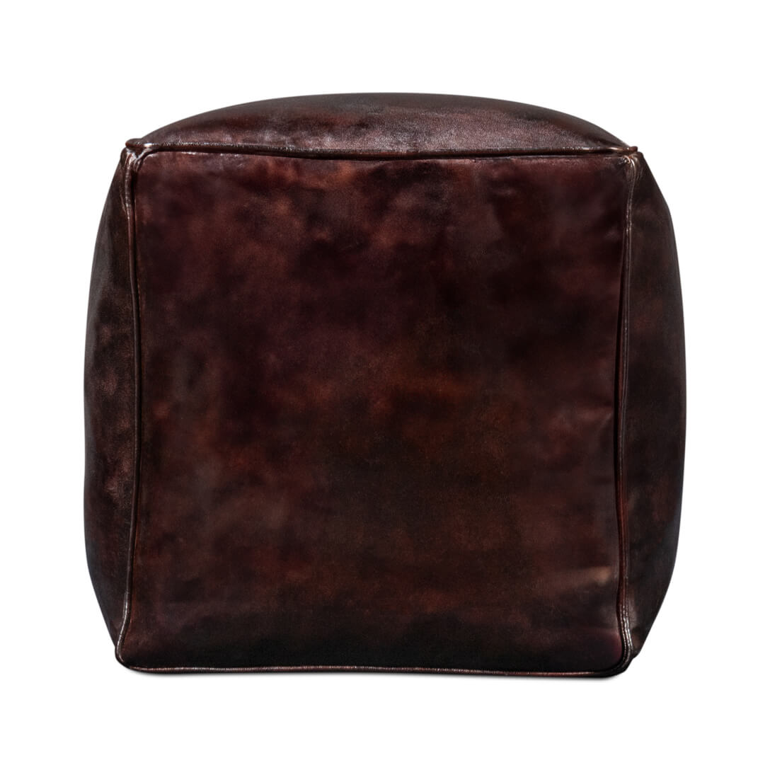 Side view of dark brown leather cube stool.