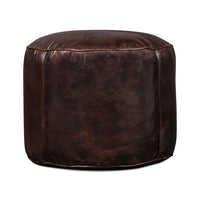 Full side view of round leather stool.