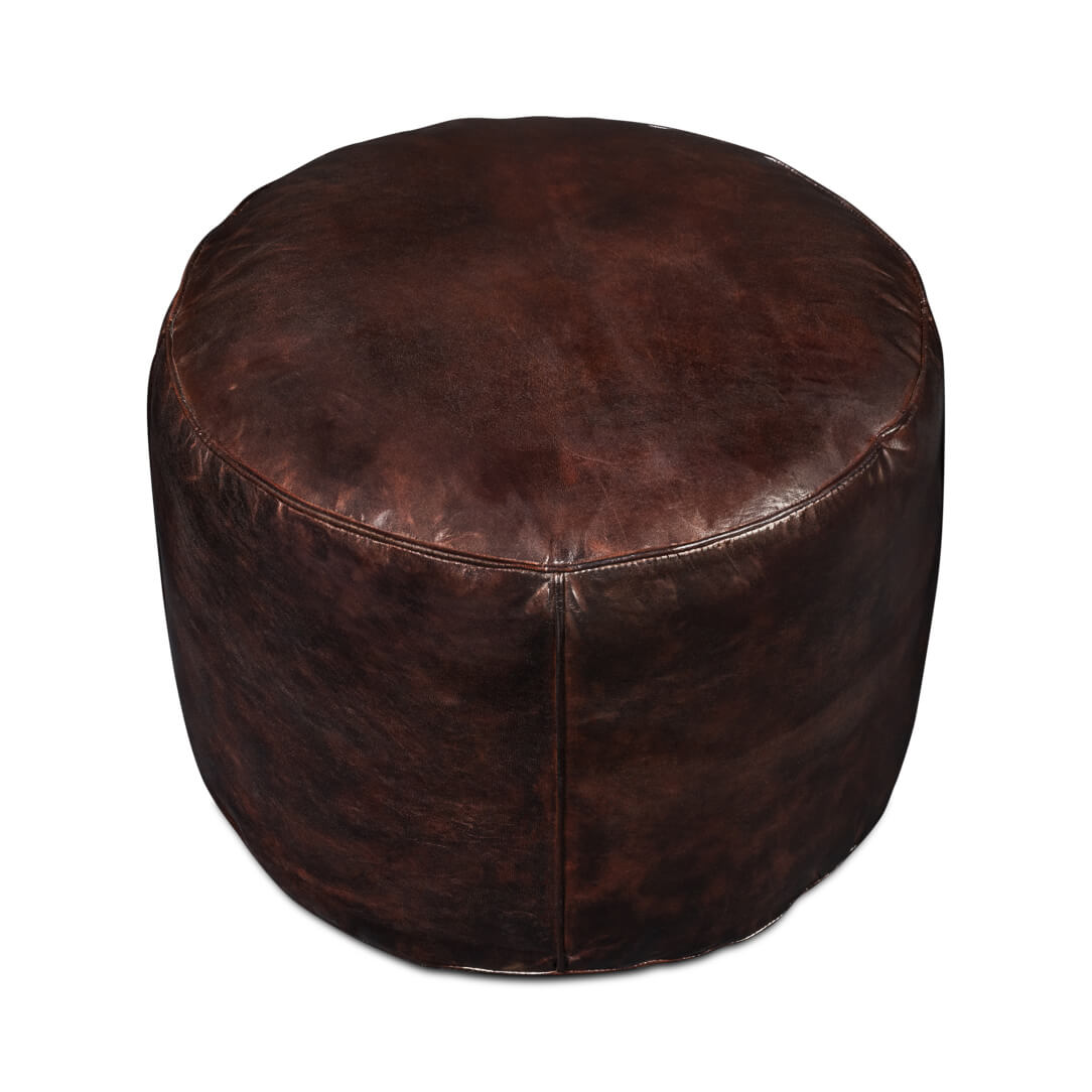 Dark brown round stool from above.