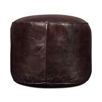 Side angle of leather stool with texture detail.