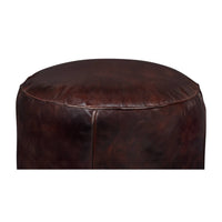Close-up front view of leather stool.