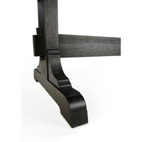Dining table leg, focus on intricate woodwork.