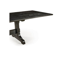 Dining table corner, showcasing surface texture.