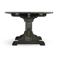 Dining table, end view highlighting trestle design.